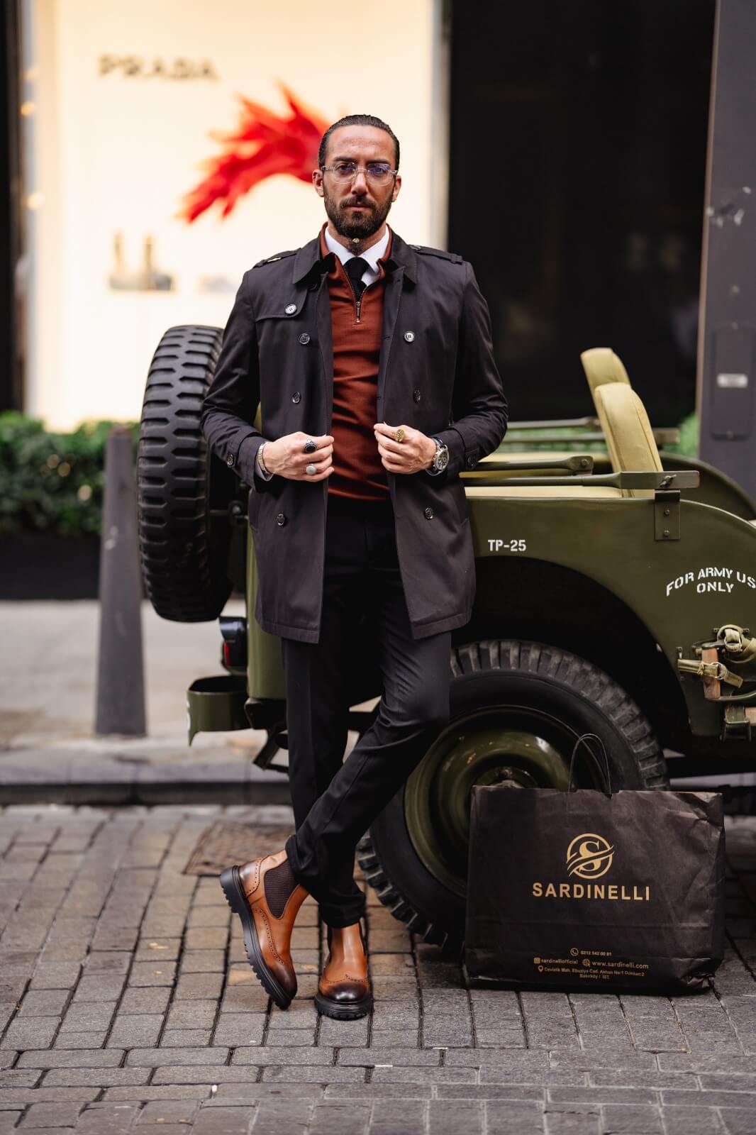 A Classic Black Trench Coat on display.