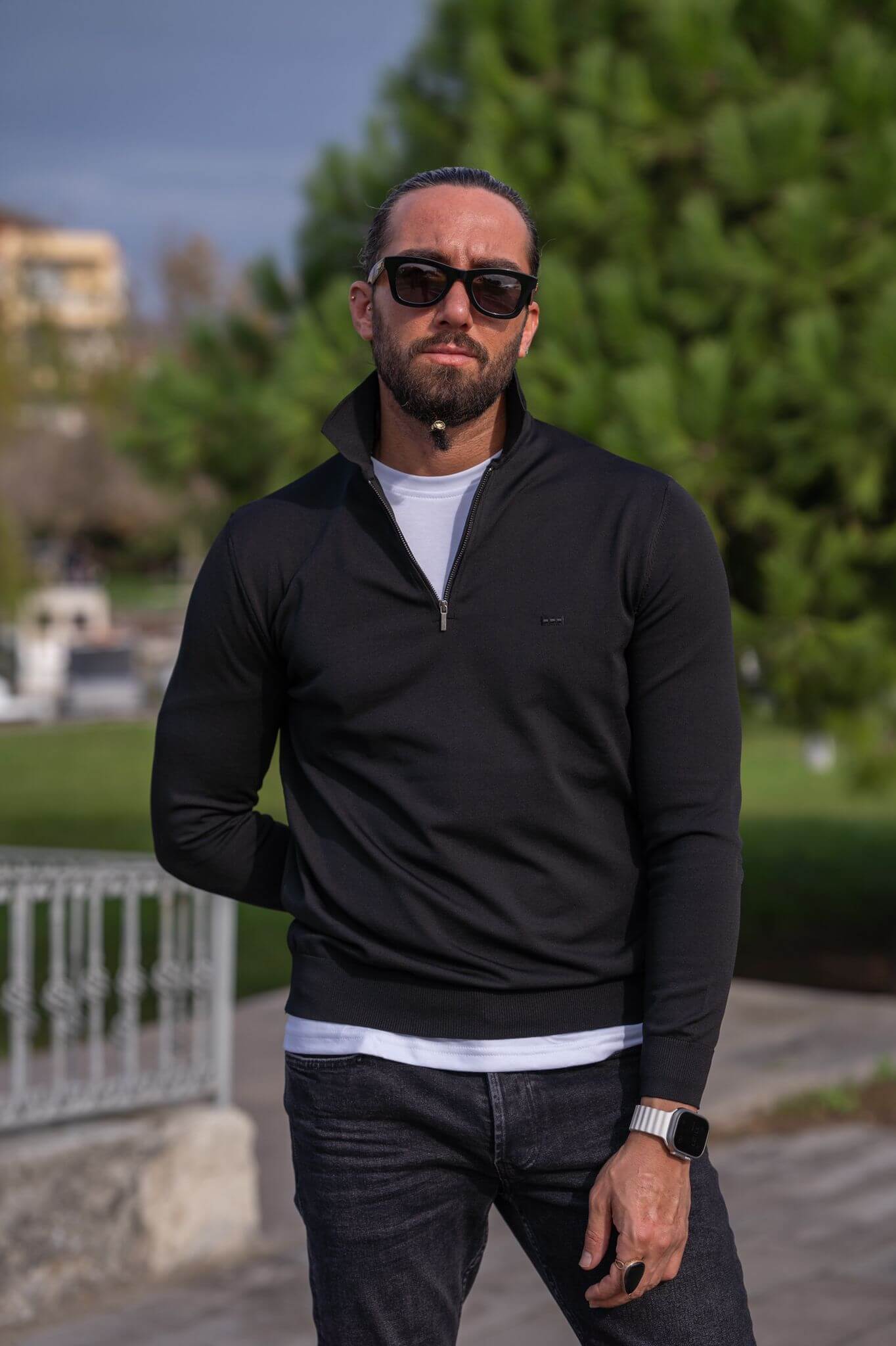 A male model wearing our Black Zipper Detailed Knitwear, exuding style and sophistication with a focus on the unique zipper