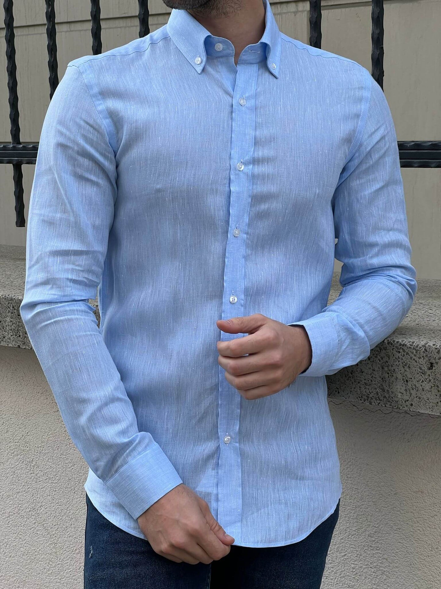 Capture the essence of casual sophistication with our male model wearing the Blue Linen Shirt, a timeless wardrobe staple