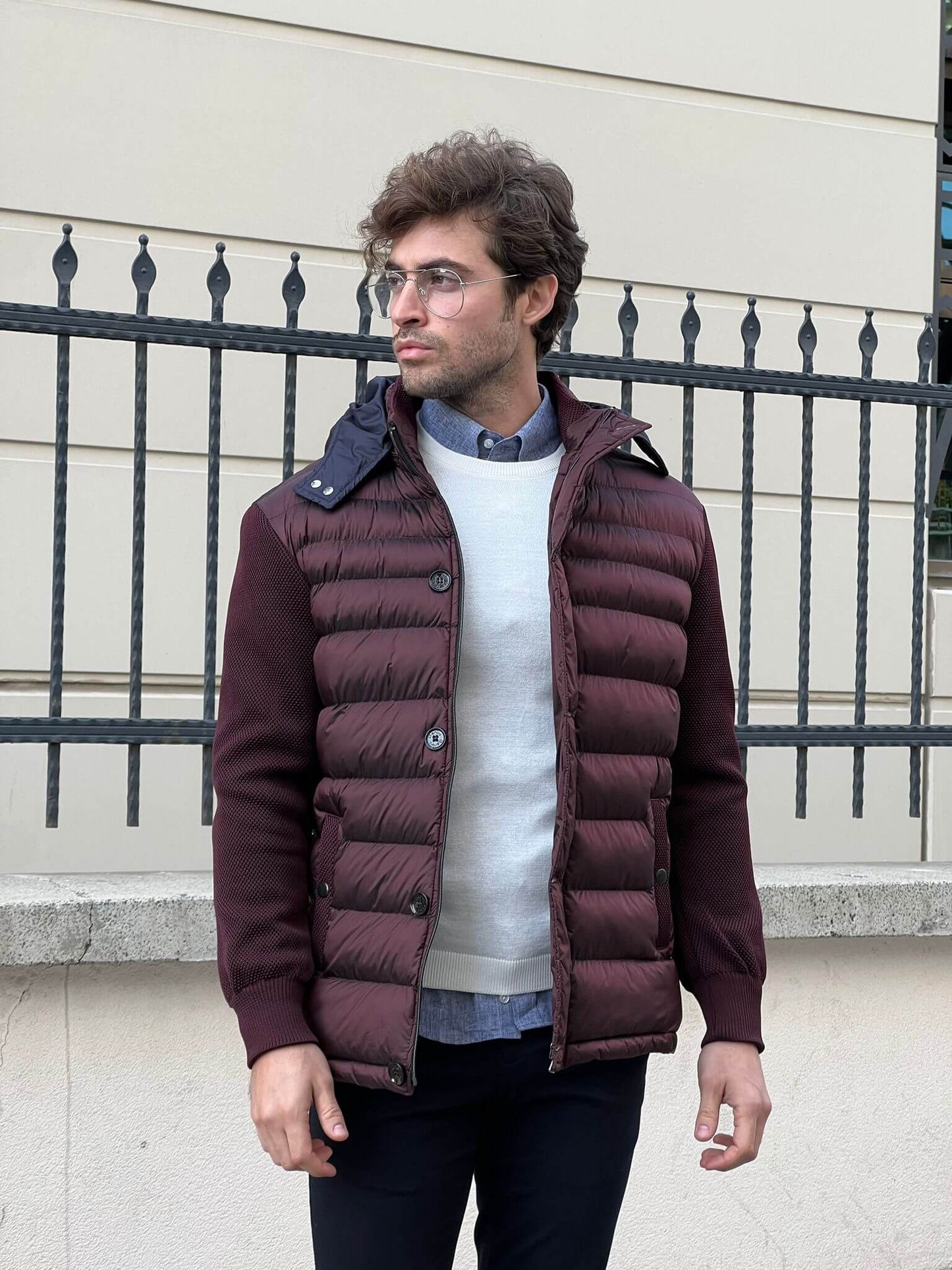 Chic and cozy: Our male model flaunts a knitted burgundy coat, a perfect blend of comfort and style.