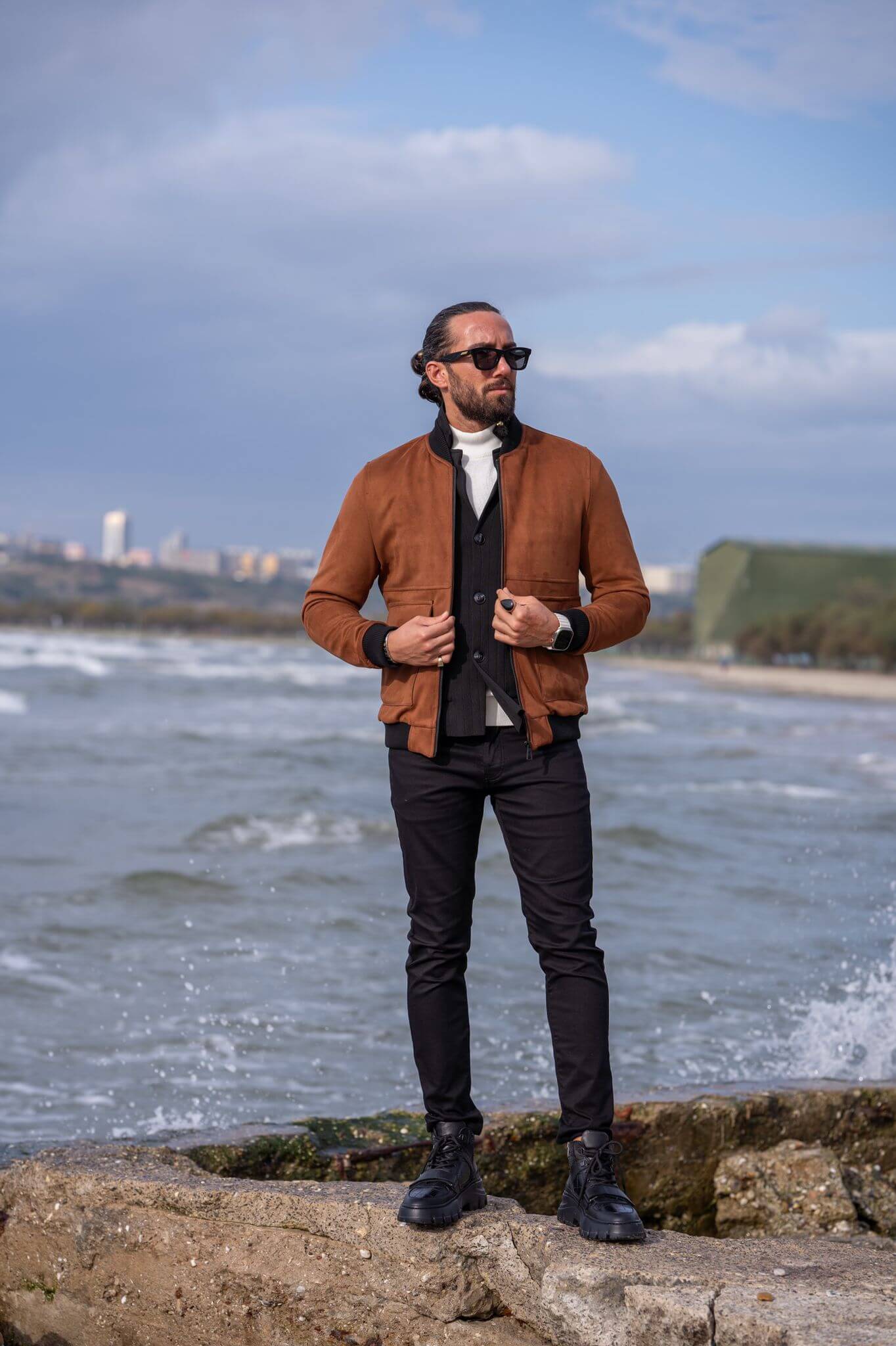 Capture the essence of modern fashion with our male model flaunting a sleek camel bomber jacket.