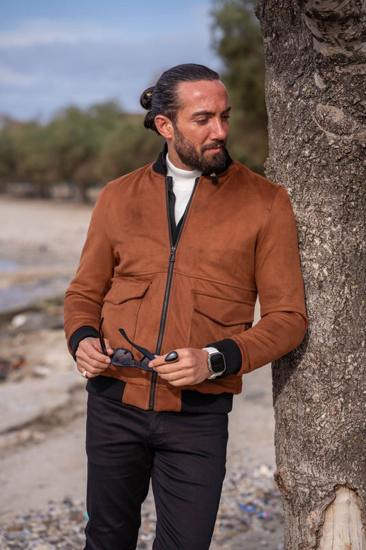 Capture the essence of modern fashion with our male model flaunting a sleek camel bomber jacket.