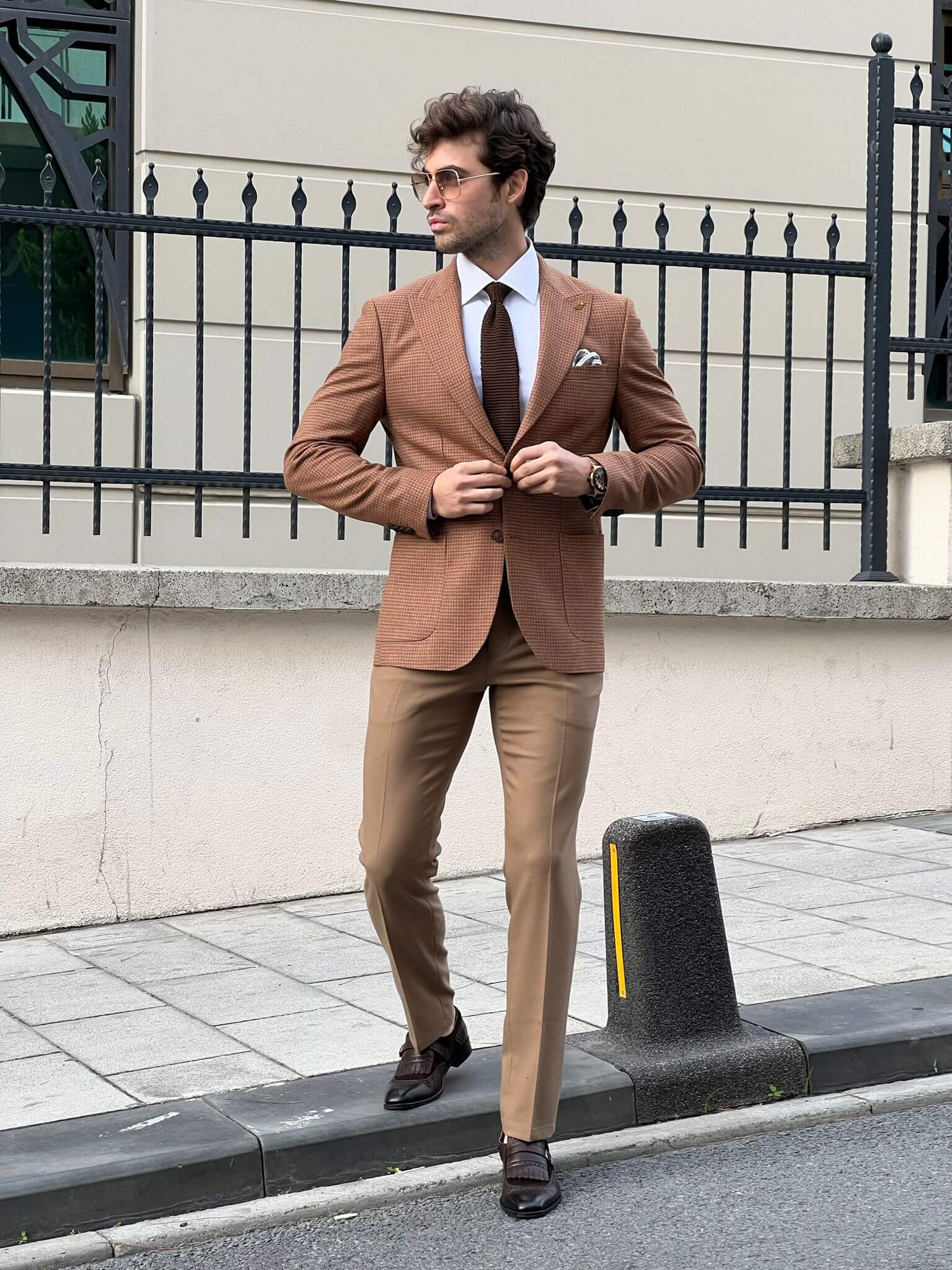 Embrace warmth and style with our Camel Wool Jacket, as showcased by our dapper male model.