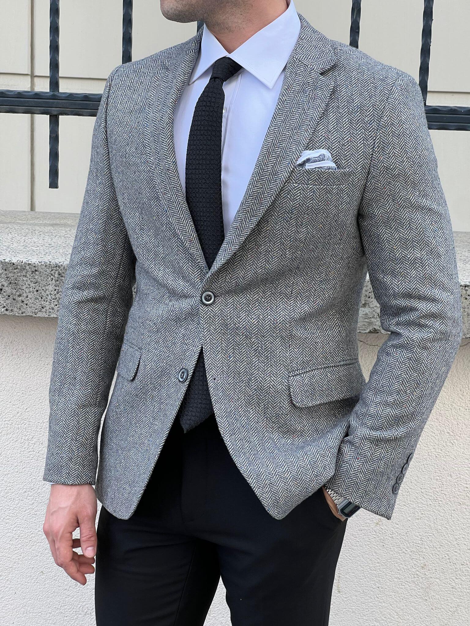 Experience timeless charm as our model effortlessly showcases the Wool Gray Jacket, a modern classic for any occasion.