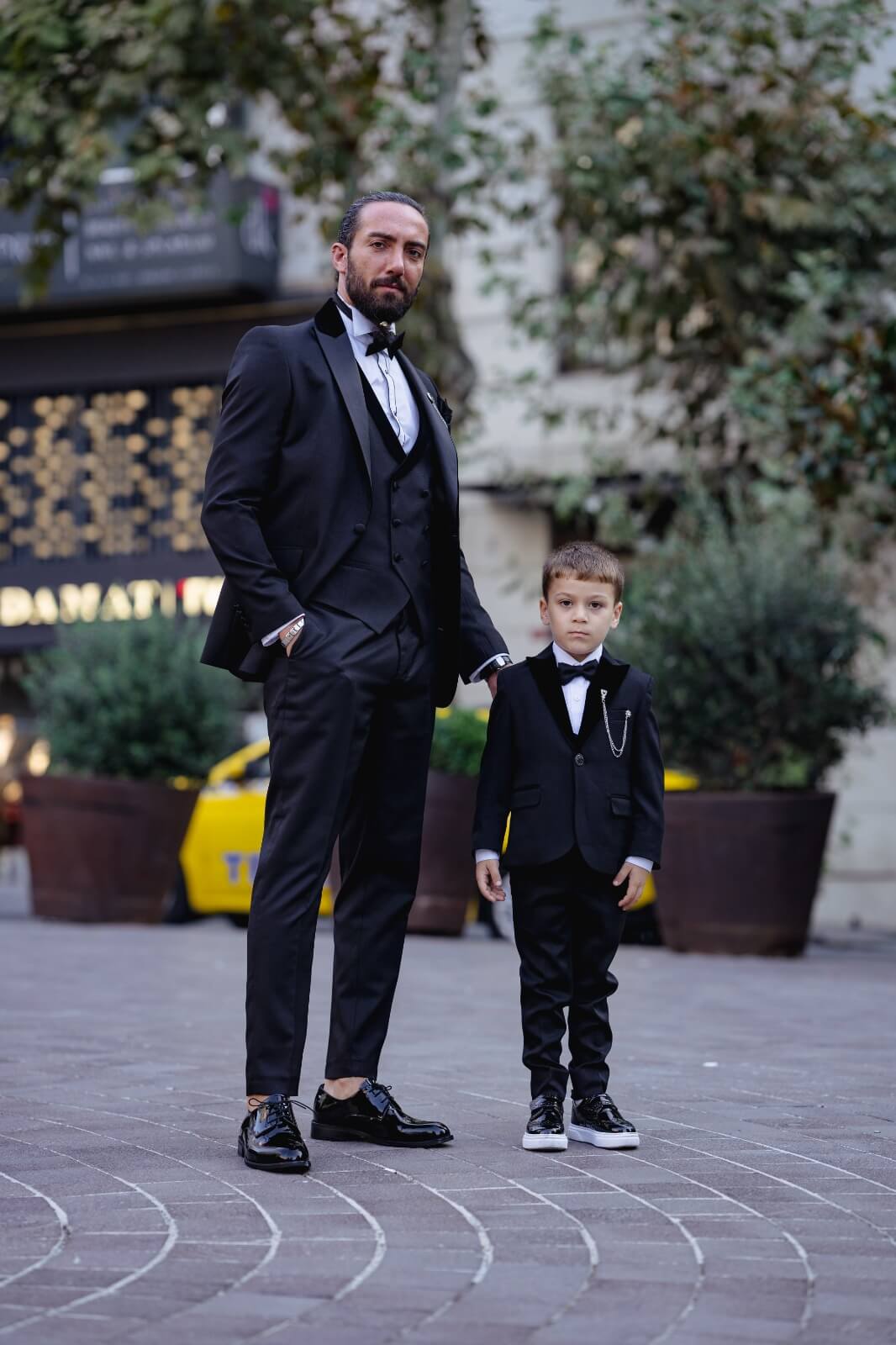 A slim-fit black boys’ tuxedo from HolloMen's Fall-Winter collection, designed with a single-button jacket, double slits, and full lining — perfect for weddings and formal occasions.