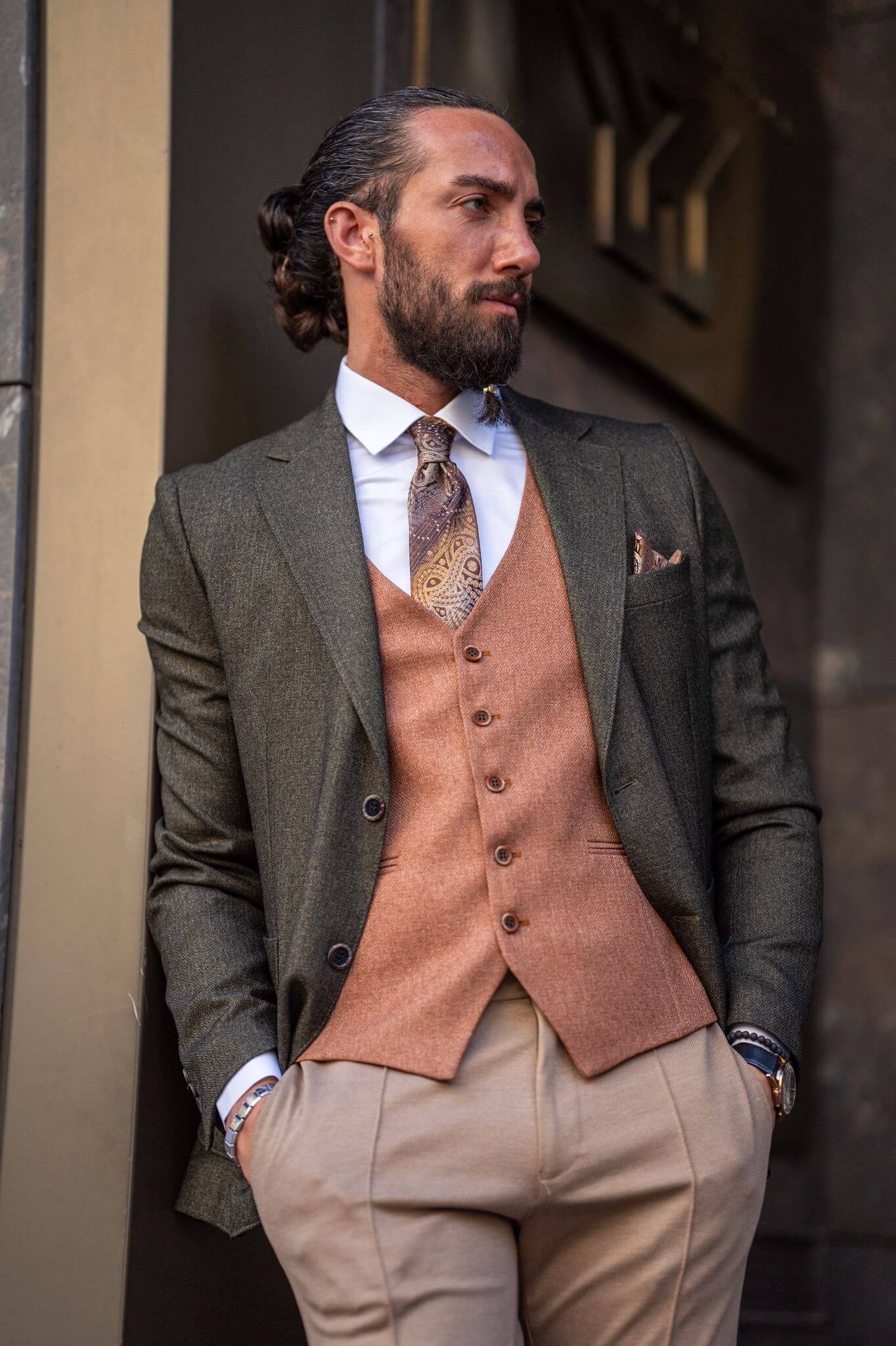 Captivating image of our male model showcasing a sophisticated khaki combination suit with a touch of timeless elegance.