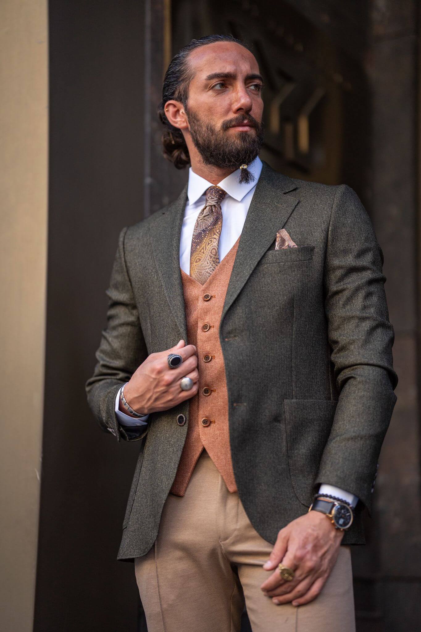 Captivating image of our male model showcasing a sophisticated khaki combination suit with a touch of timeless elegance.