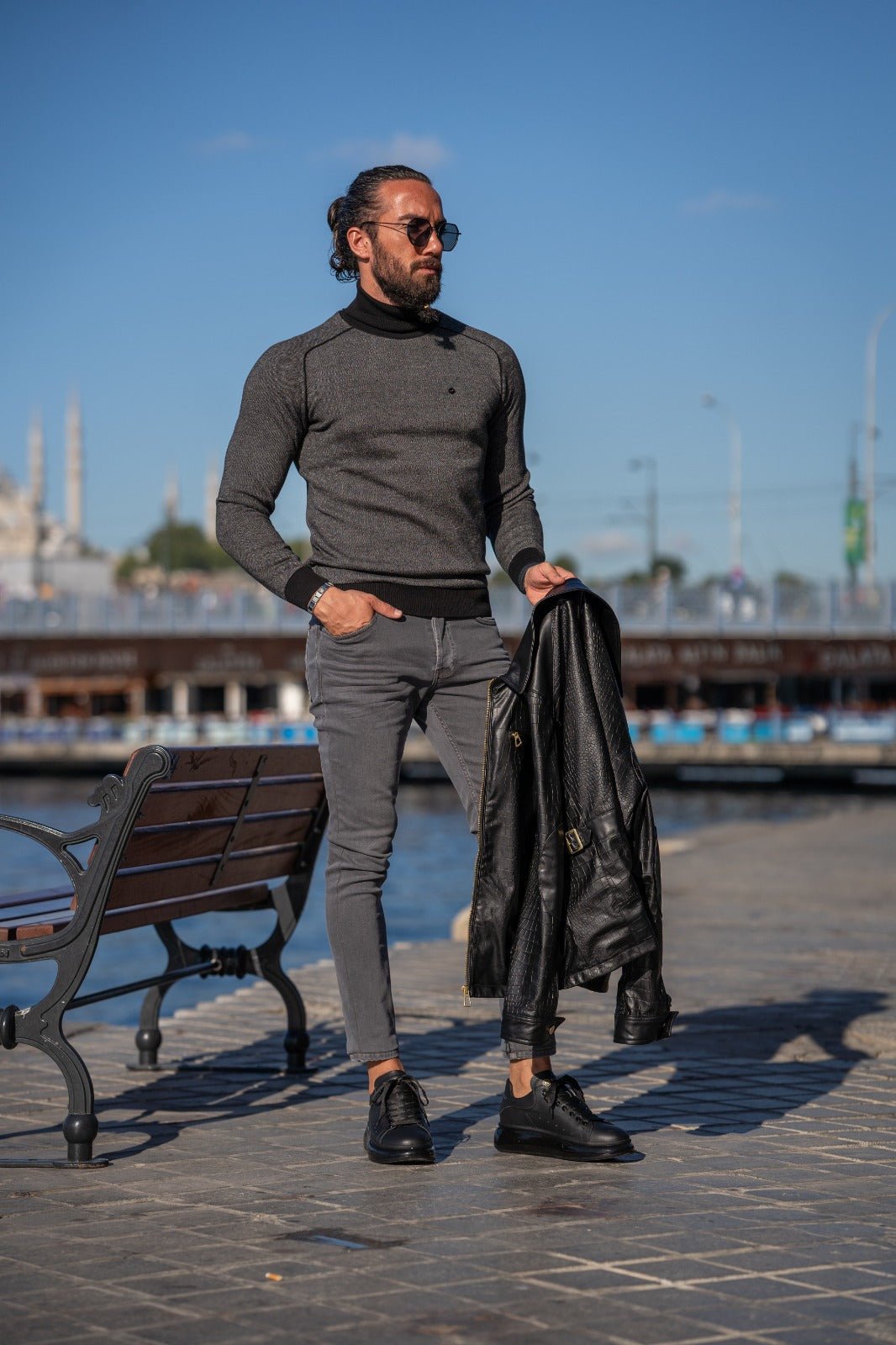 A Black Slim Fit Full Turtleneck Sweater on display. 