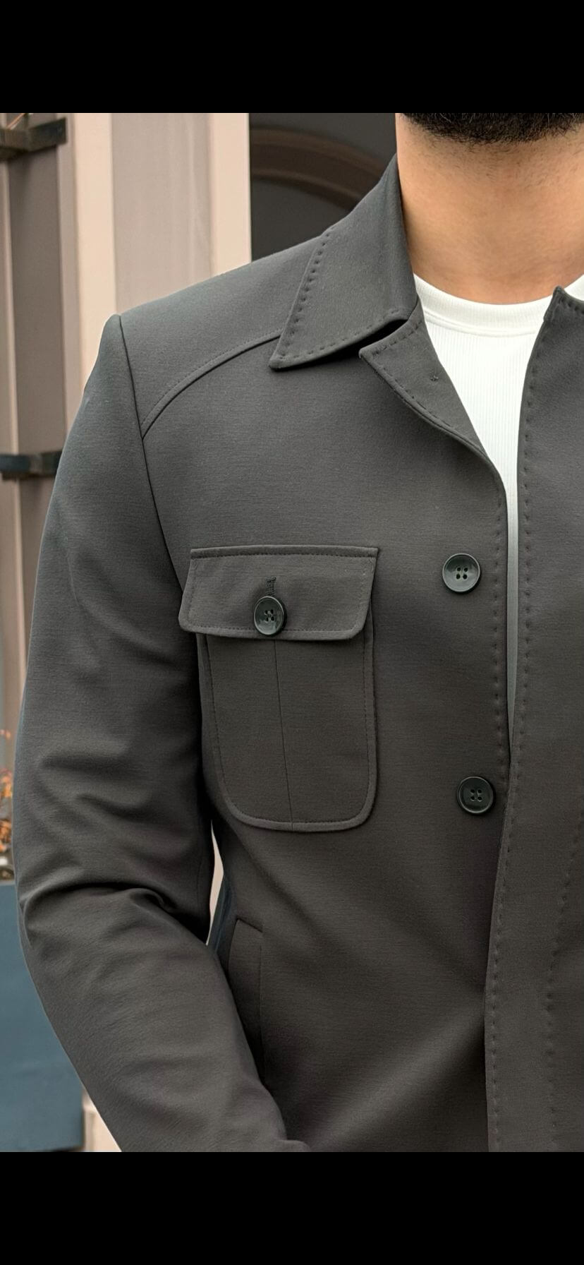 Men’s khaki utility jacket set with button-down overshirt and tapered pants styled with white sneakers in a modern smart casual outfit