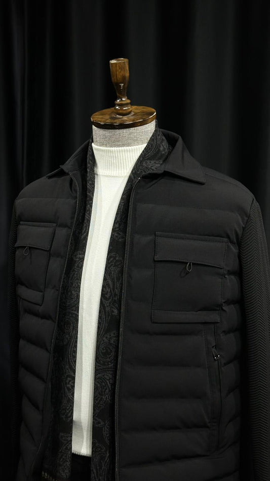 Men’s black quilted winter jacket with front zip closure, insulated polyester fabric, and chest pockets