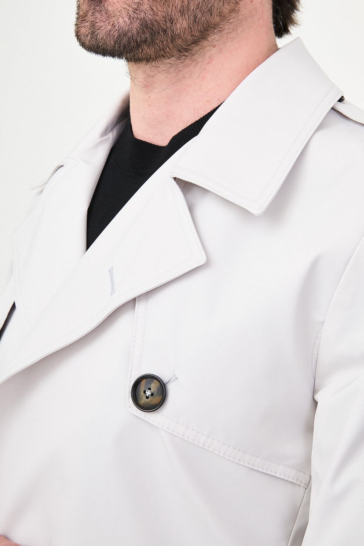 Men’s white double breasted trench coat with belt and tailored fit for fall winter fashion