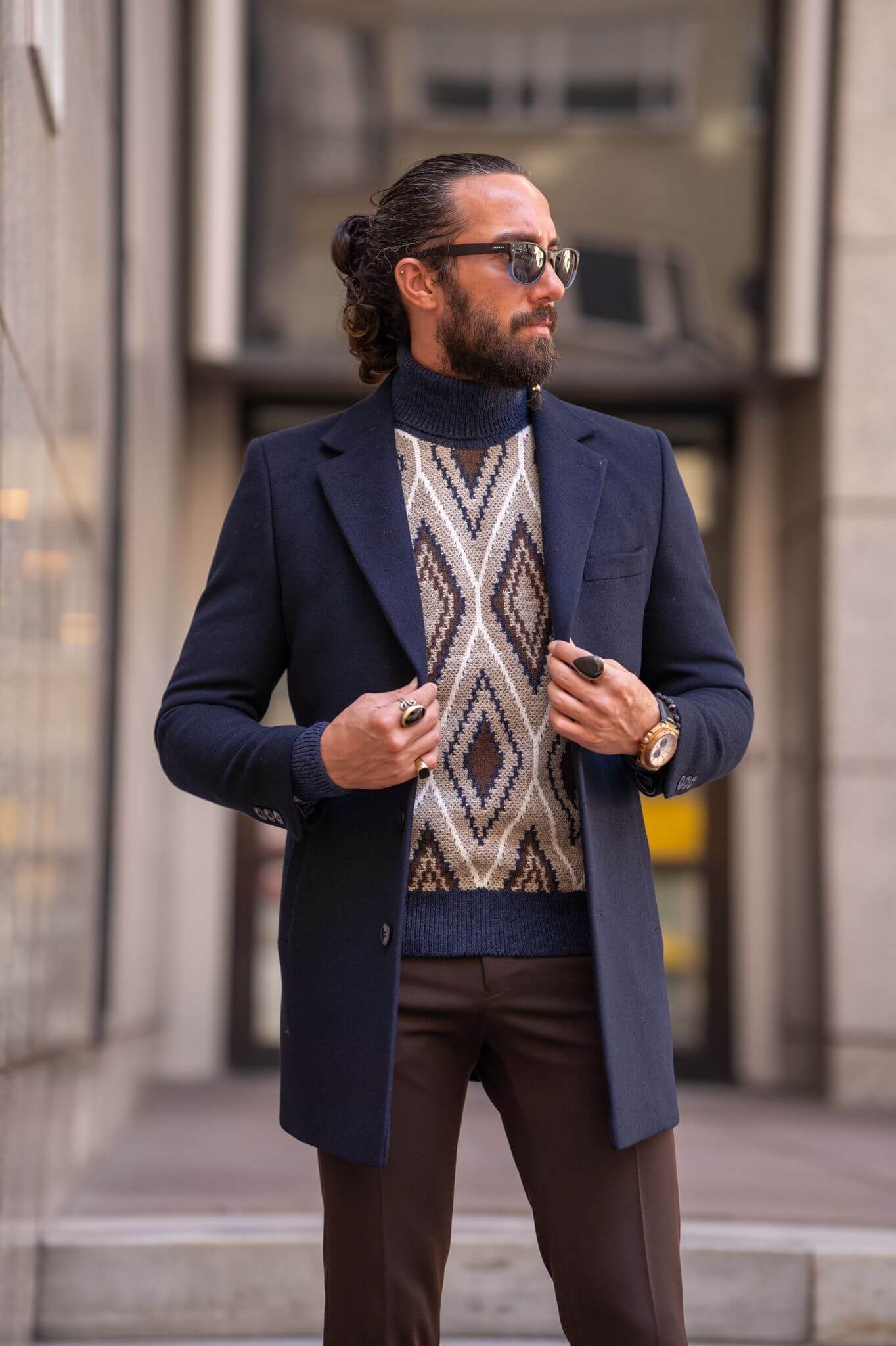 Striking male model confidently presents our latest fashion statement: the Navy Blue Coat,