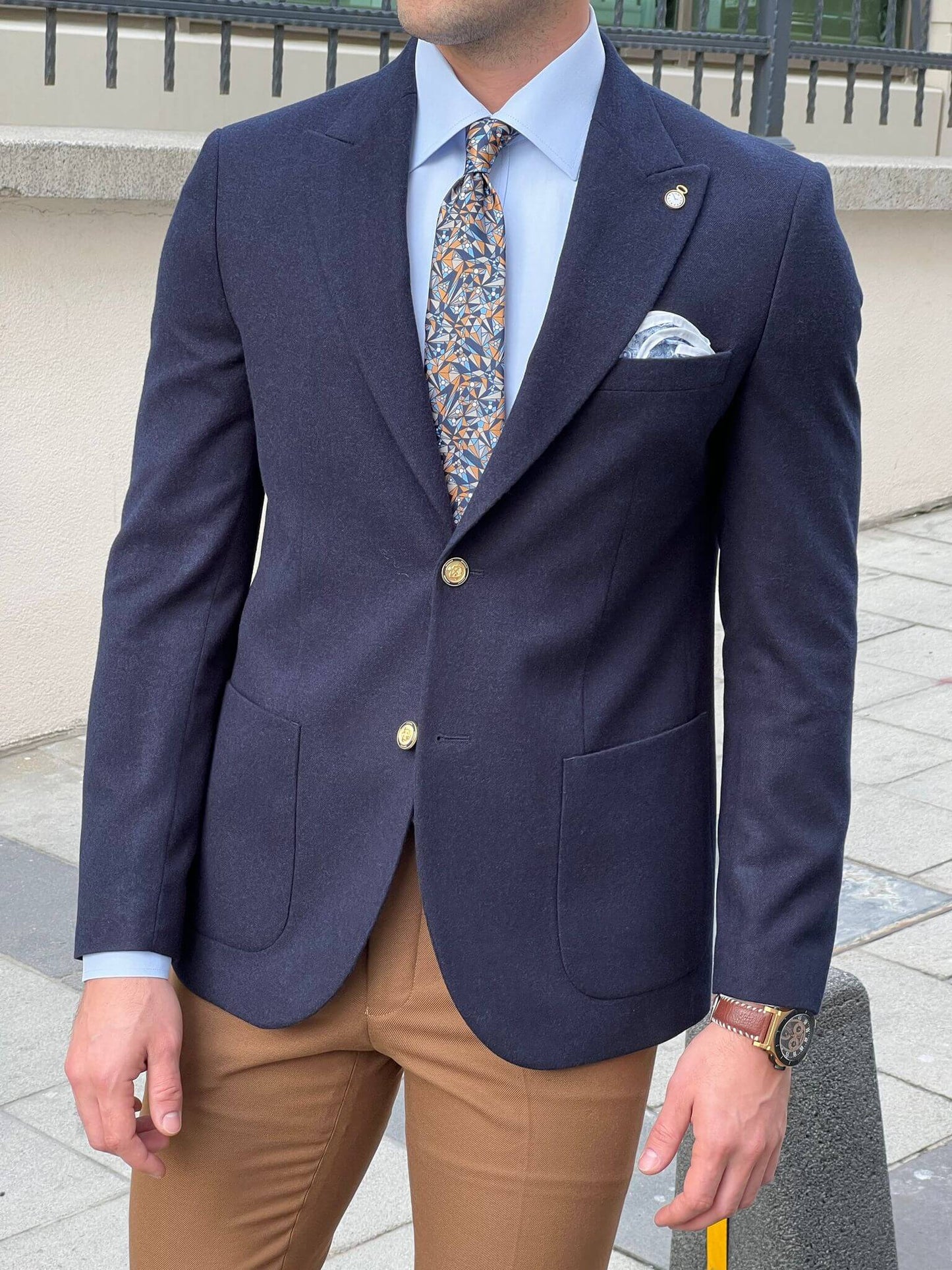 Dapper and distinguished: our male model effortlessly rocks a navy blue jacket, defining contemporary elegance.