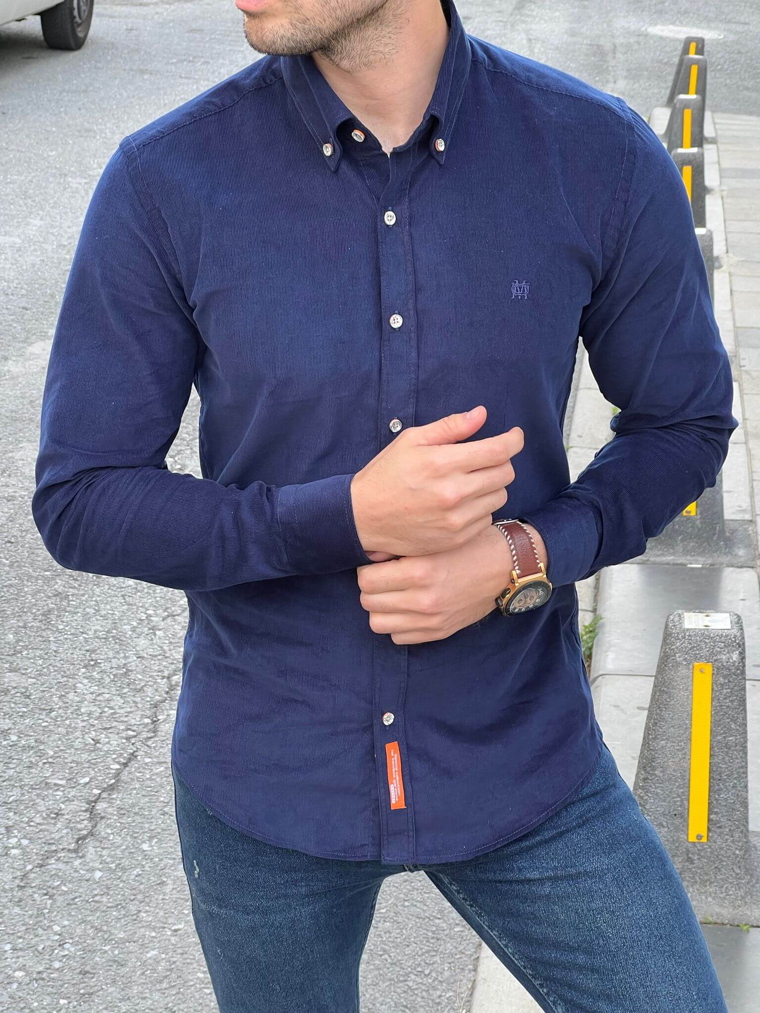 Confident male model exudes style in our Velvet Navy Blue Shirt, capturing attention with its rich texture and timeless elegance