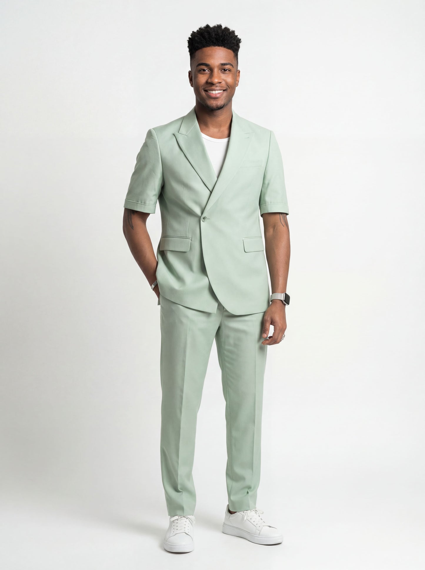 Mint green short sleeve prom suit worn by young male model