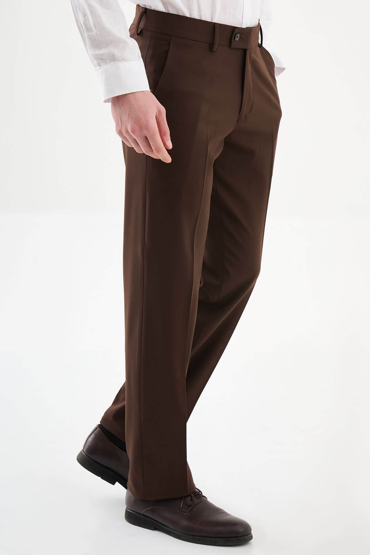 Men wearing brown slim-fit classic trousers, styled with formal shoes and a dress shirt, ideal for business and formal events.