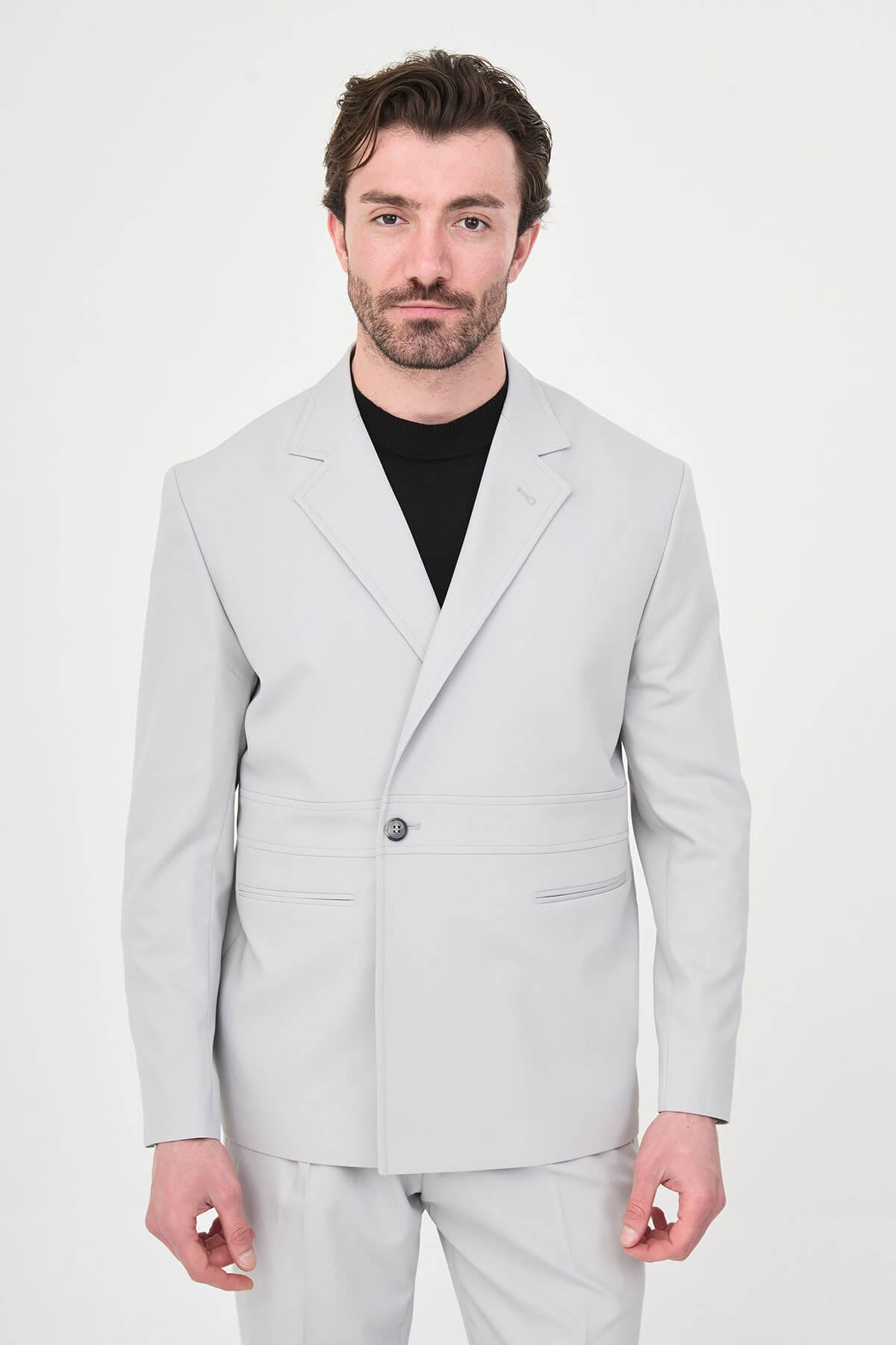 Light Gray Slim Fit Men’s Suit, two-piece formal suit jacket and trousers, styled with black dress shoes, perfect for weddings and business events.