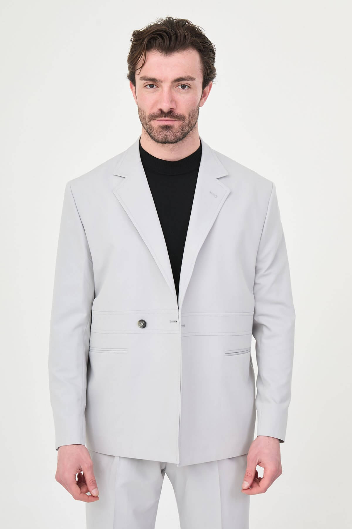 Light Gray Slim Fit Men’s Suit, two-piece formal suit jacket and trousers, styled with black dress shoes, perfect for weddings and business events.