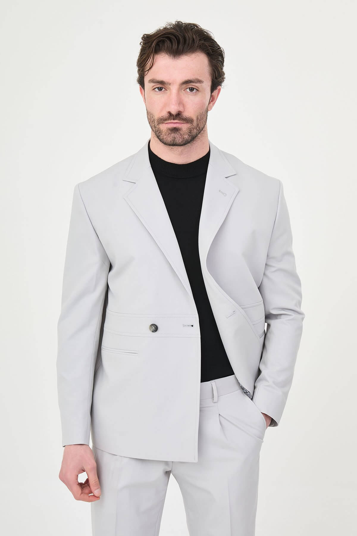 Light Gray Slim Fit Men’s Suit, two-piece formal suit jacket and trousers, styled with black dress shoes, perfect for weddings and business events.