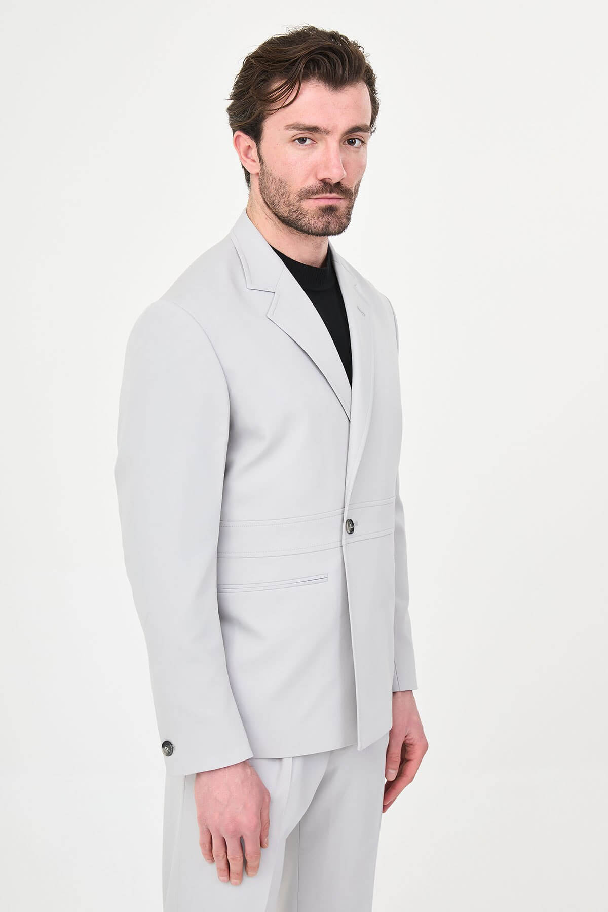 Light Gray Slim Fit Men’s Suit, two-piece formal suit jacket and trousers, styled with black dress shoes, perfect for weddings and business events.