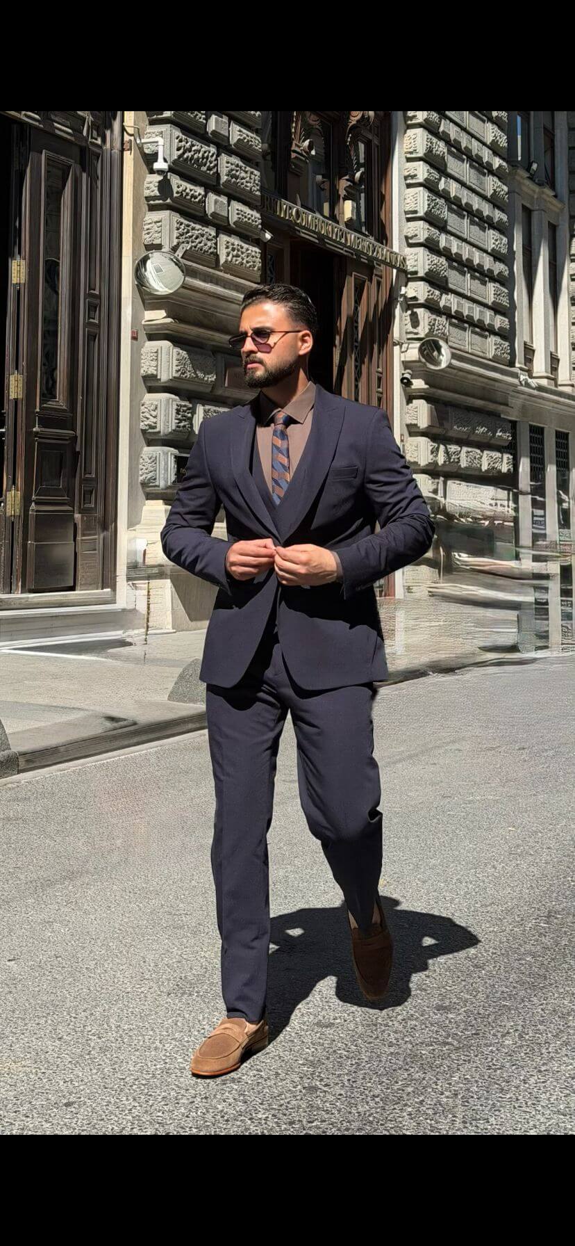 Men’s navy blue three piece suit with tailored jacket, matching waistcoat, trousers, and elegant formal design for weddings, business, and special occasions.