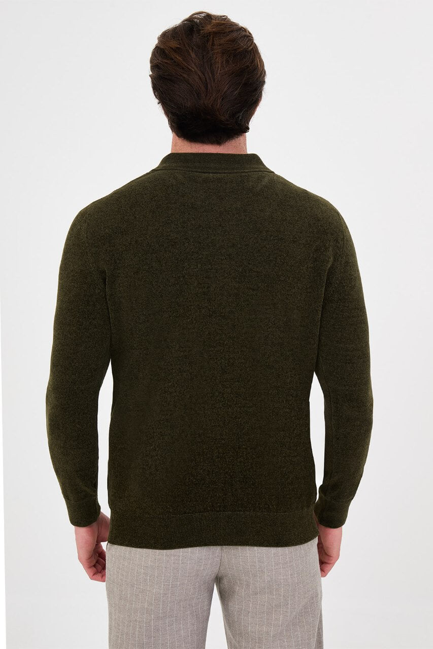 Men’s khaki polo neck knit sweater with zip collar detail styled with grey trousers for a refined fall winter smart-casual outfit.