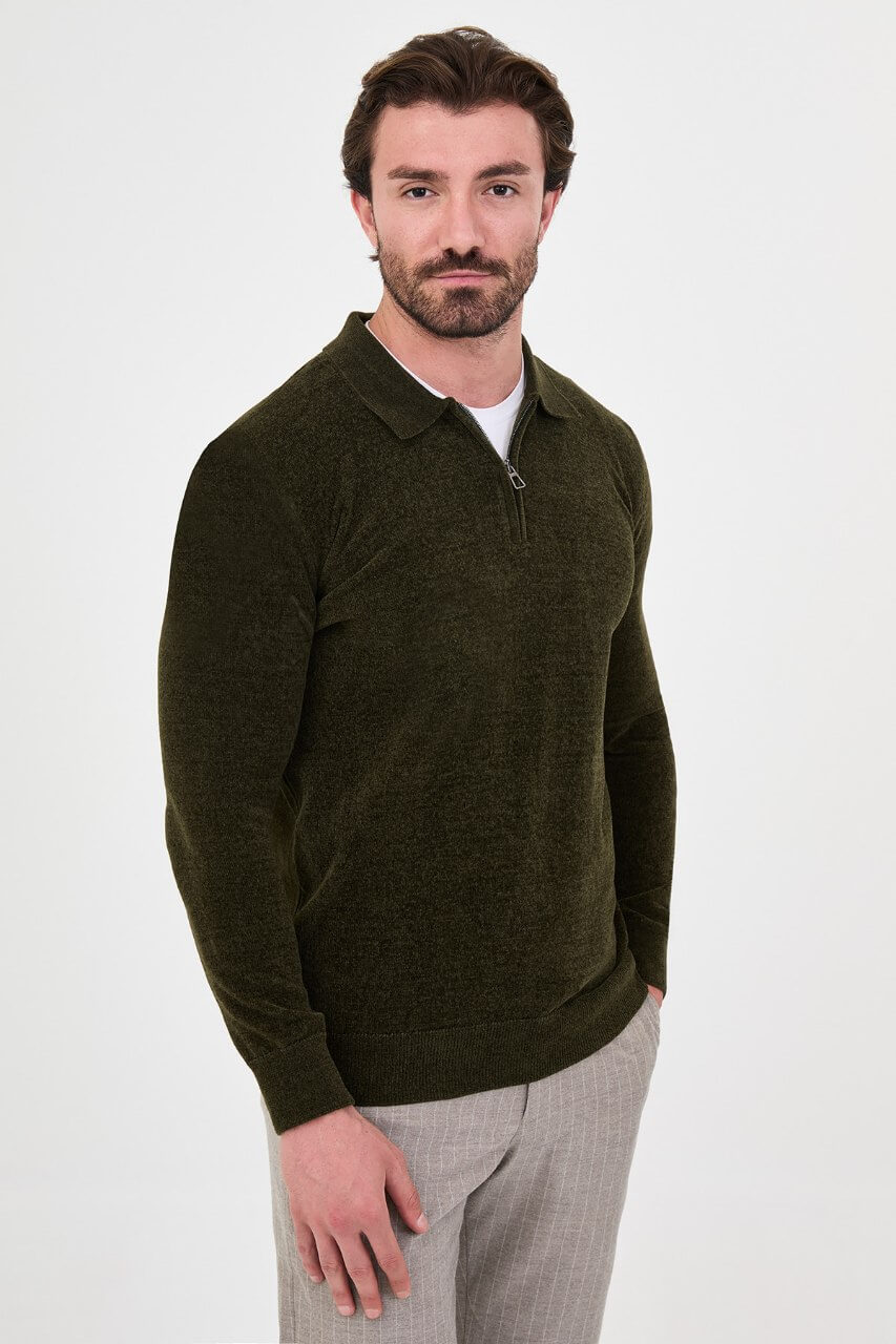 Men’s khaki polo neck knit sweater with zip collar detail styled with grey trousers for a refined fall winter smart-casual outfit.