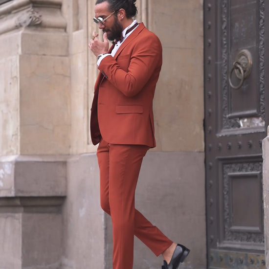 Men’s slim-fit tile collar tuxedo in slate gray with pointed collar and two-button front – styled for formal winter events, weddings, or high-fashion black-tie affairs.