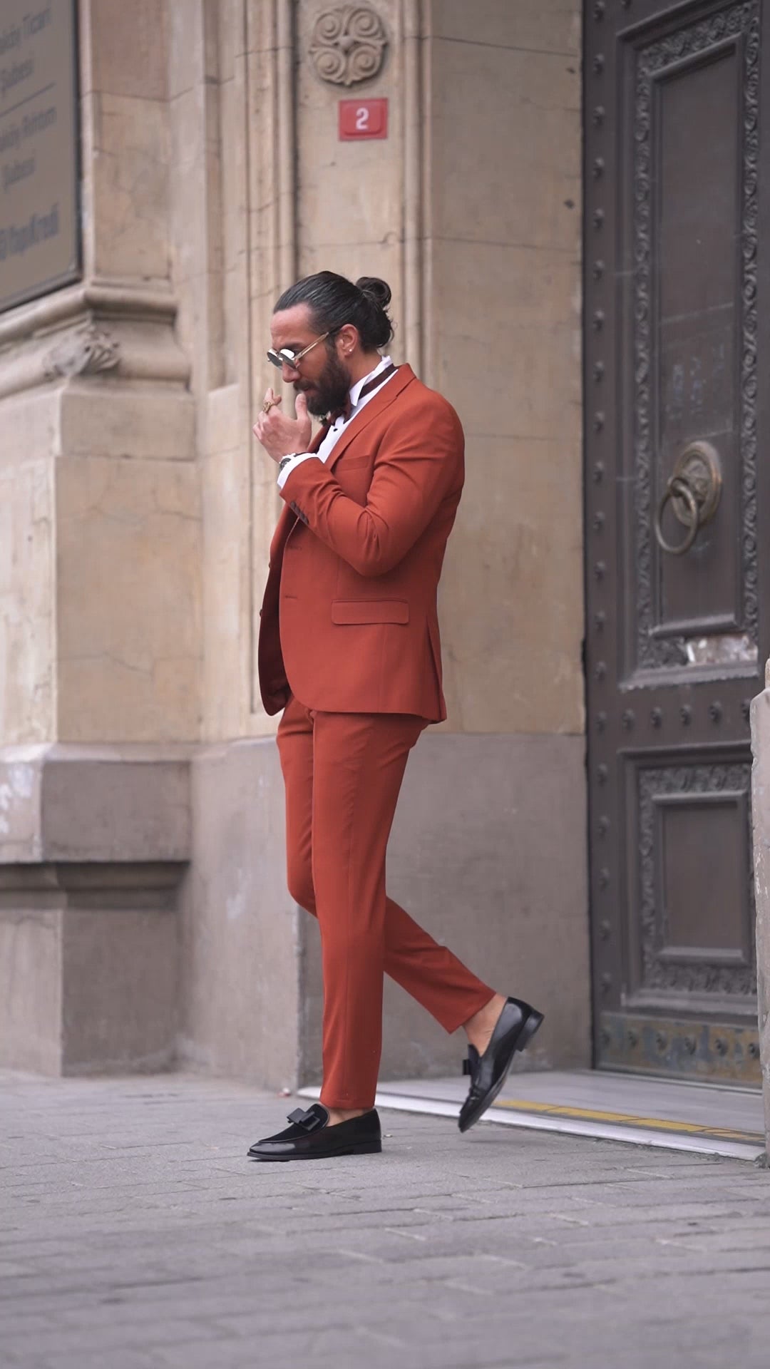 Men’s slim-fit tile collar tuxedo in slate gray with pointed collar and two-button front – styled for formal winter events, weddings, or high-fashion black-tie affairs.