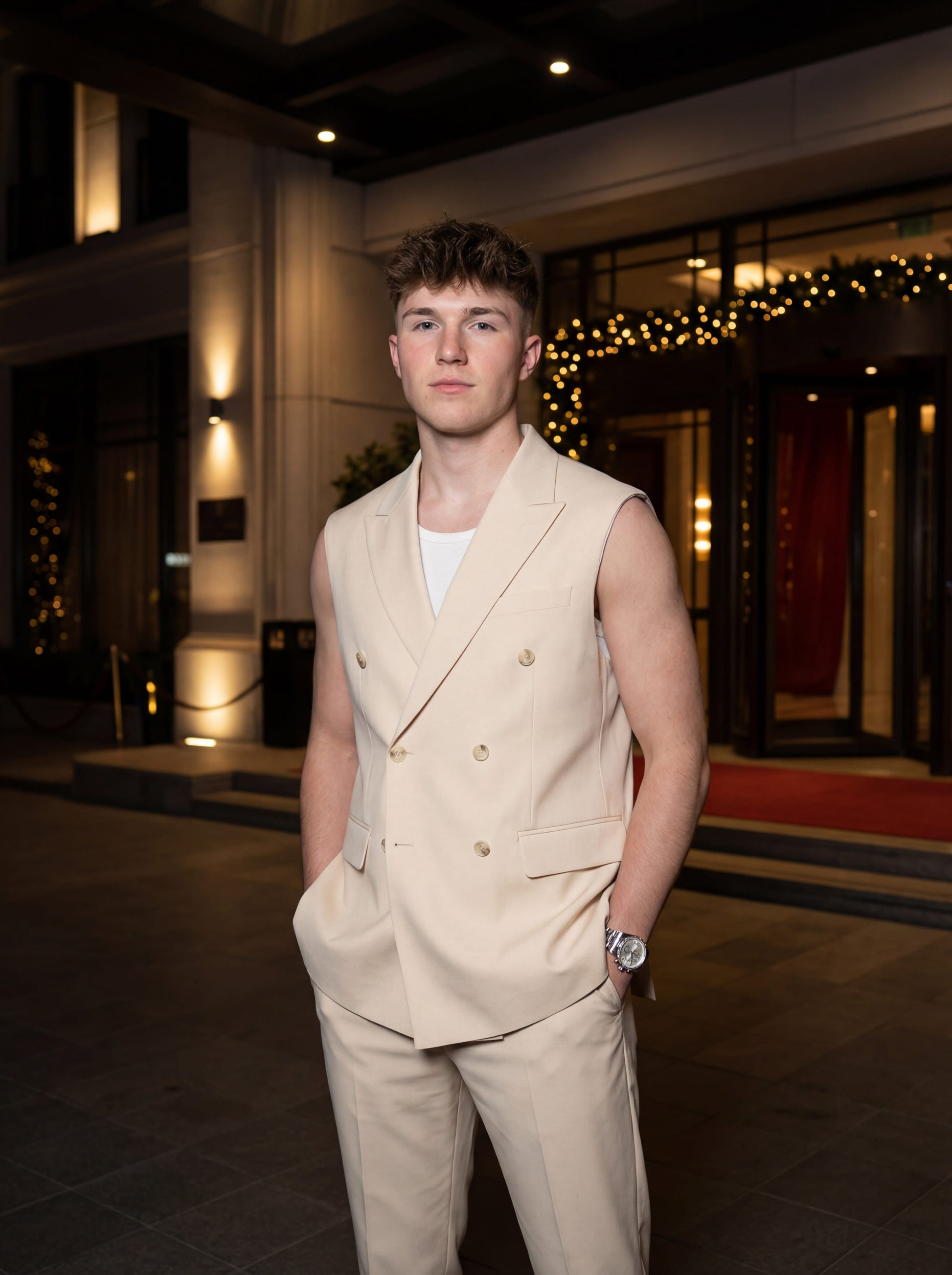 Beige sleeveless slim fit prom suit styled for modern prom night