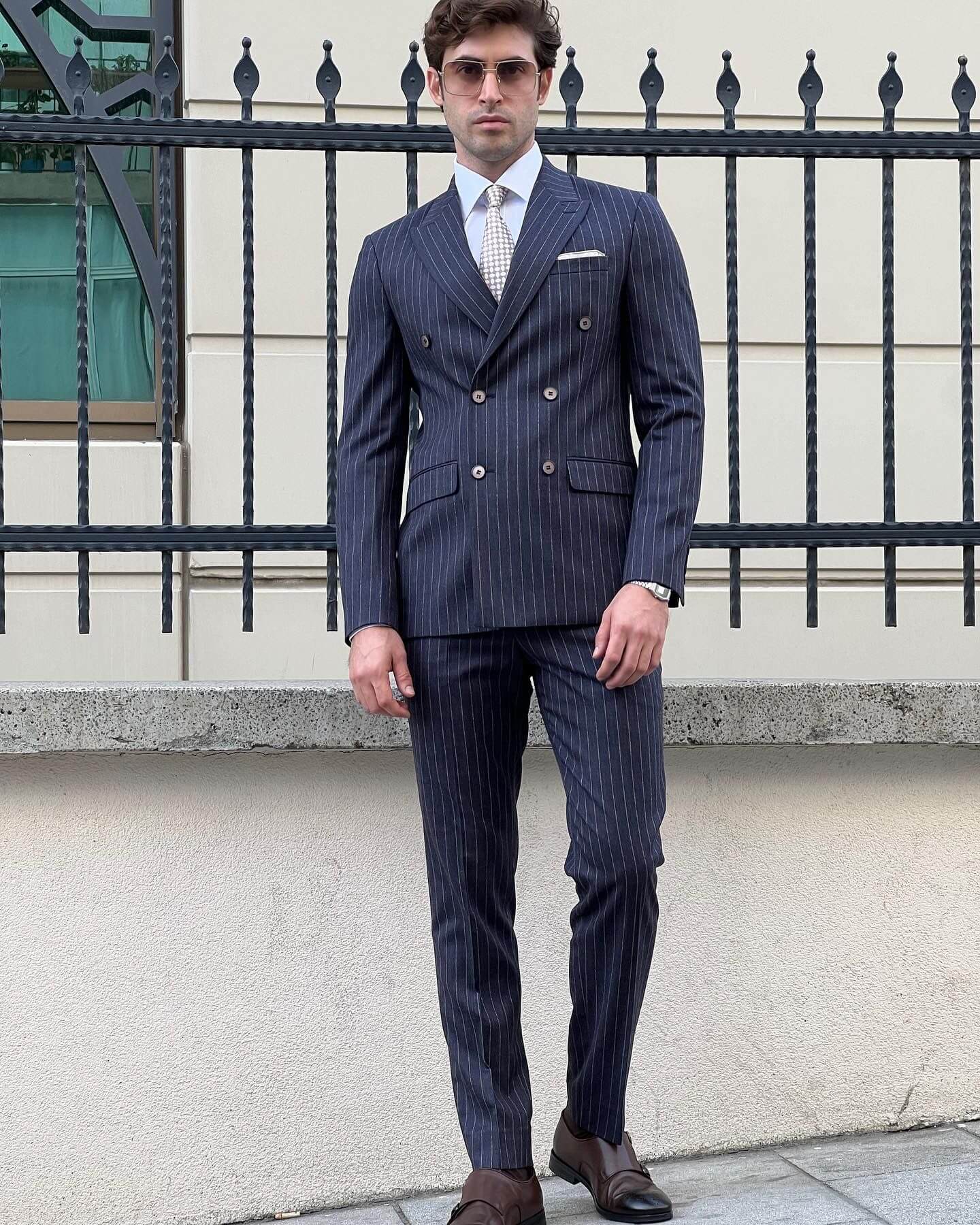 Witness the epitome of modern suiting as our model showcases the sleek lines of the Smoked Wool suit