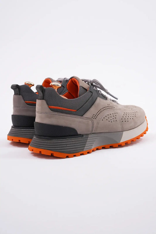 TrailBlaze Gray Leather Performance Sneakers with orange sole and perforated design.