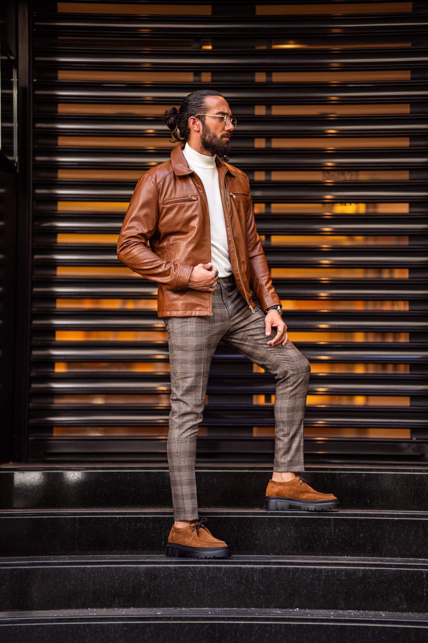 A Tan Leather Coat on display.