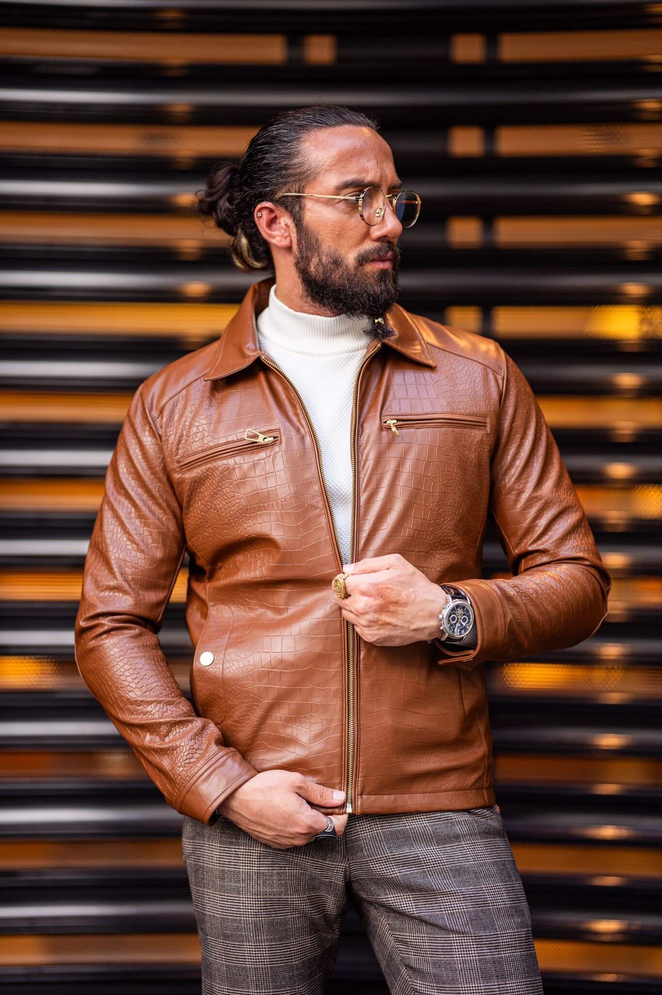 A Tan Leather Coat on display.