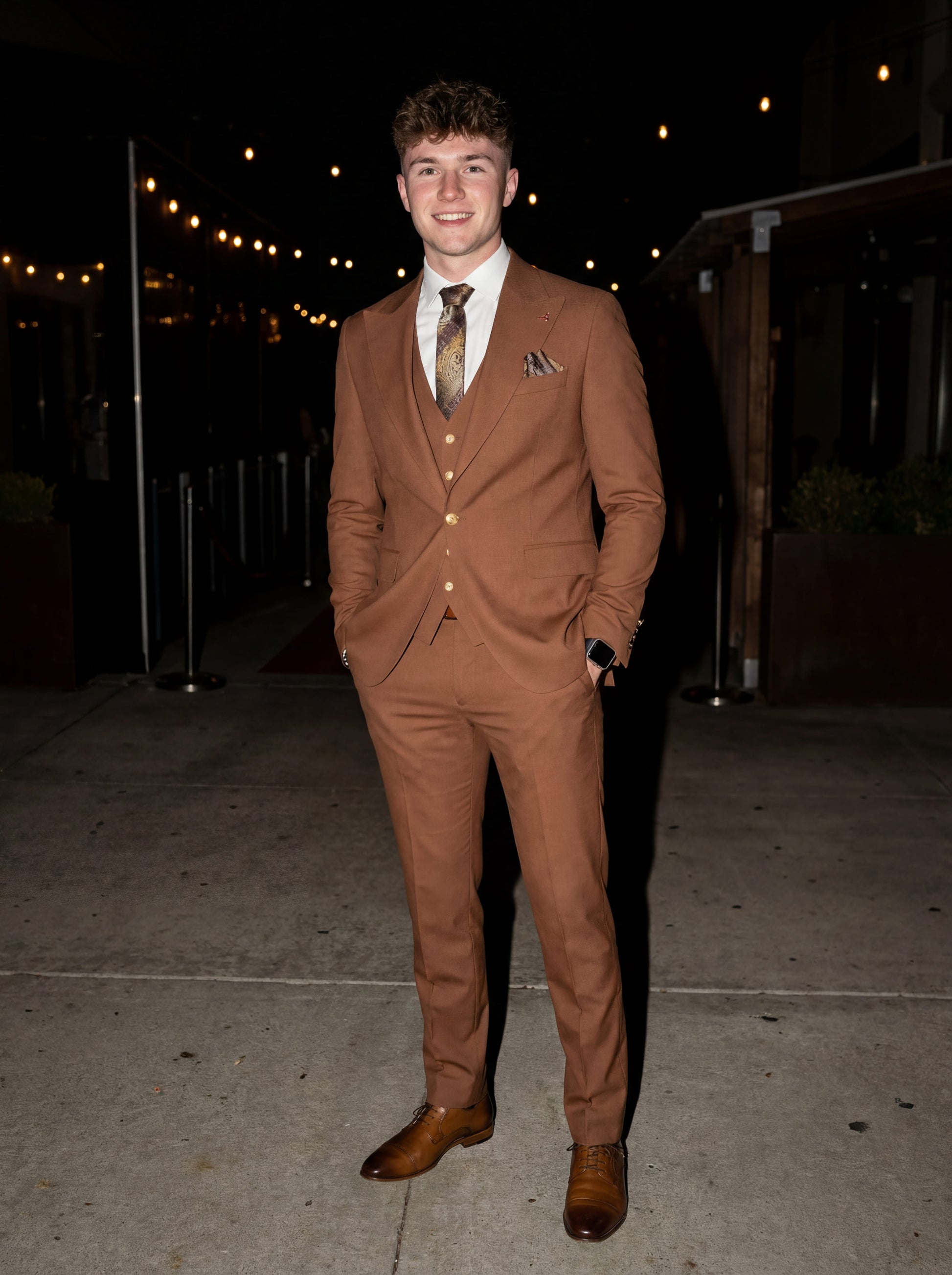 Tile brown slim fit three-piece prom suit styled for formal evening event