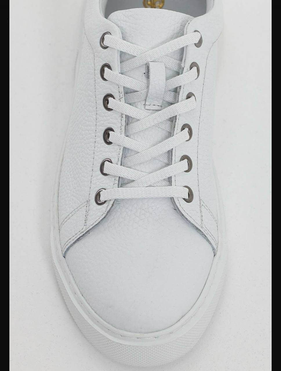 white leather low-top sneakers with white laces and EVA sole.