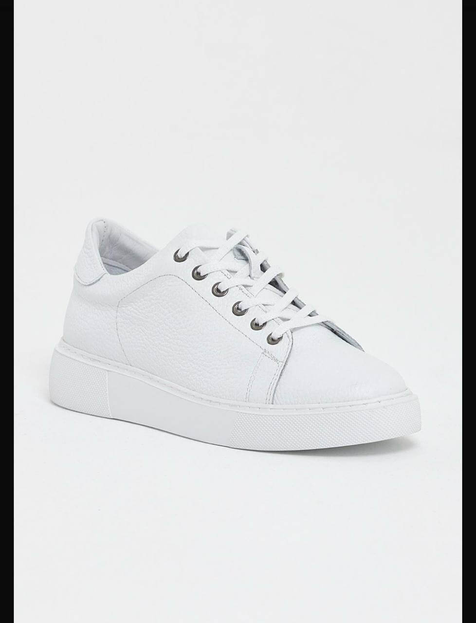 white leather low-top sneakers with white laces and EVA sole.