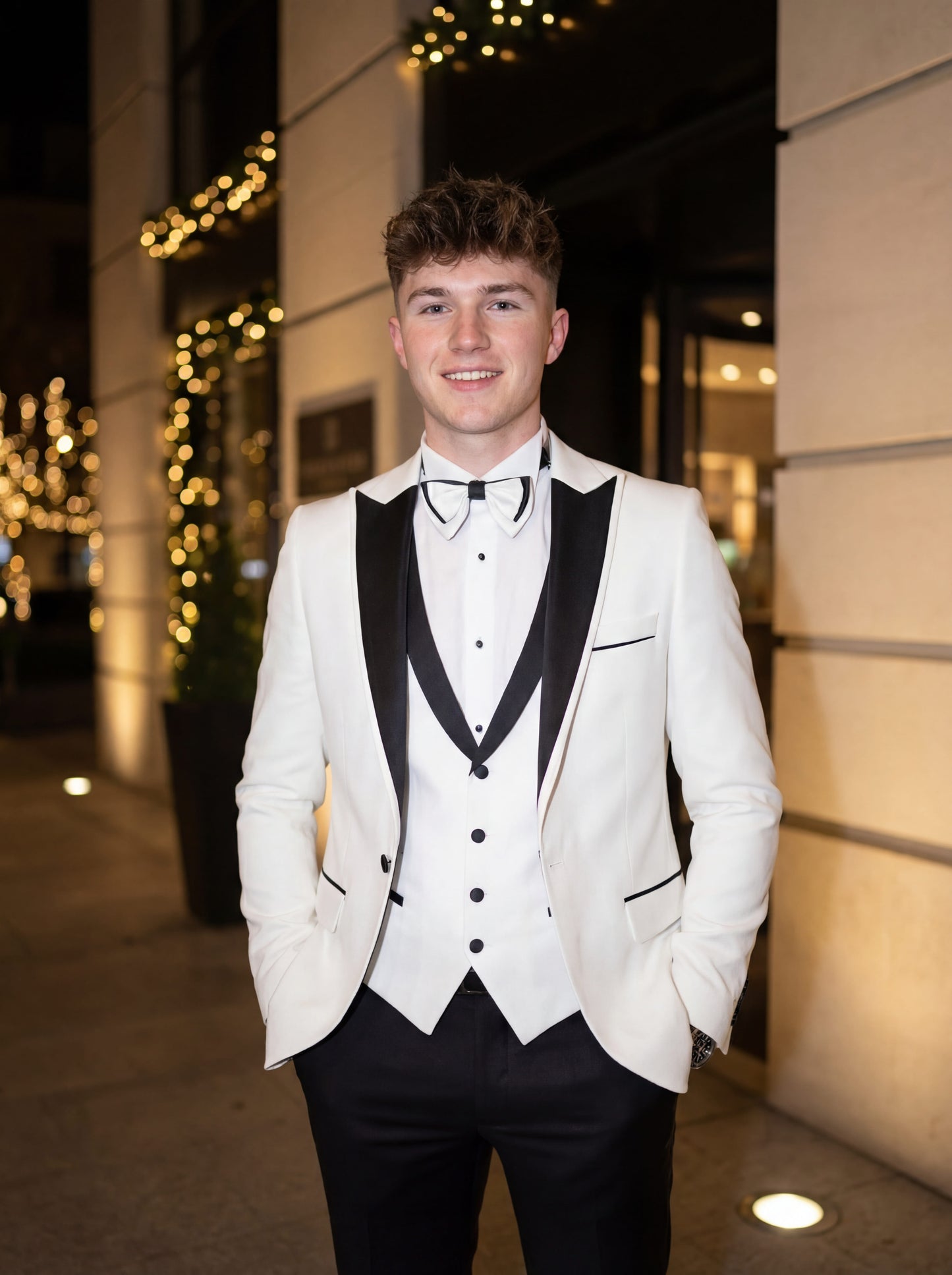 White slim fit prom tuxedo with black satin shawl lapel styled for formal prom event