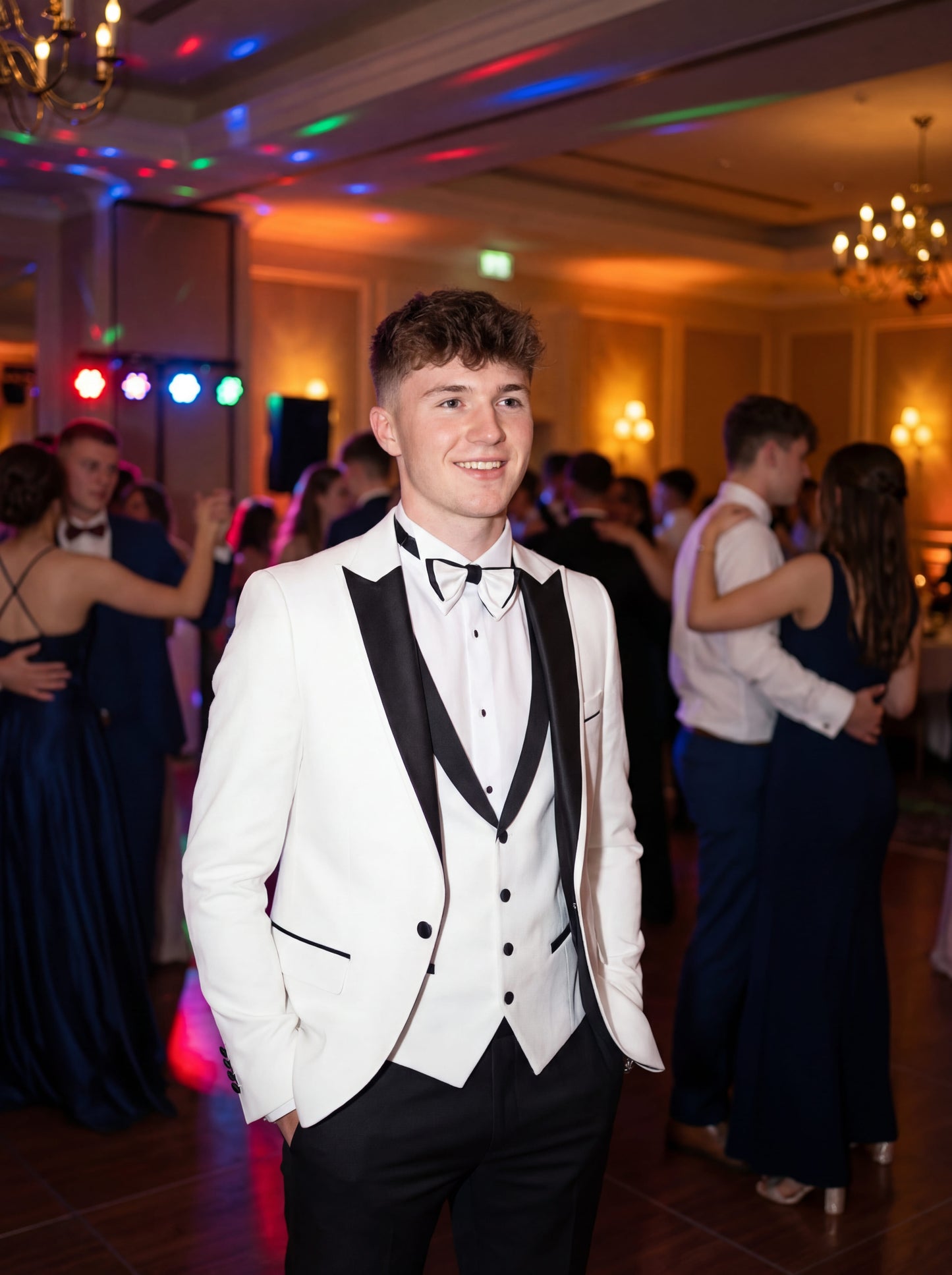 White slim fit prom tuxedo with black satin shawl lapel styled for formal prom event