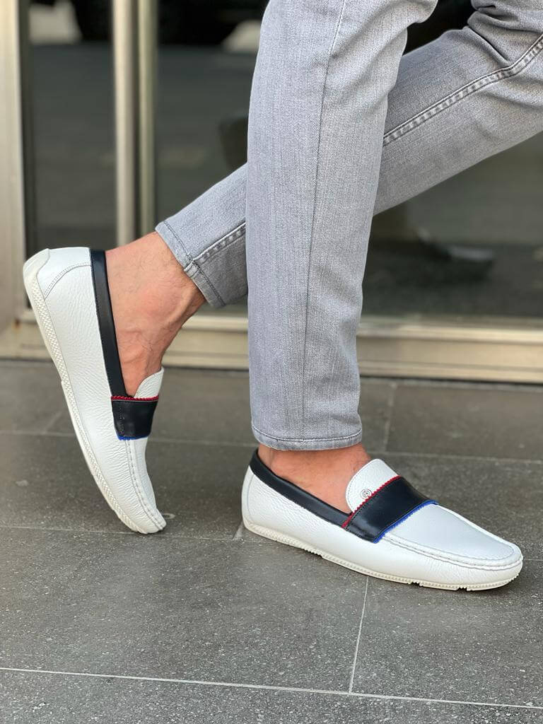 Elegant white leather casual loafers with a sleek rubber sole, styled for Spring-Summer versatility and minimalist sophistication.