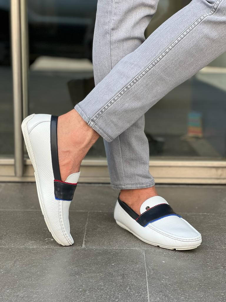 Elegant white leather casual loafers with a sleek rubber sole, styled for Spring-Summer versatility and minimalist sophistication.