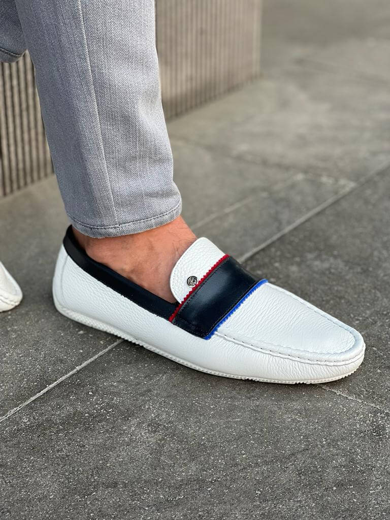 Elegant white leather casual loafers with a sleek rubber sole, styled for Spring-Summer versatility and minimalist sophistication.