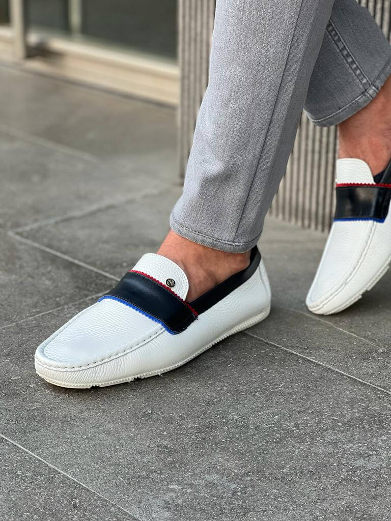 Elegant white leather casual loafers with a sleek rubber sole, styled for Spring-Summer versatility and minimalist sophistication.