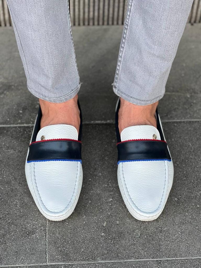 Elegant white leather casual loafers with a sleek rubber sole, styled for Spring-Summer versatility and minimalist sophistication.