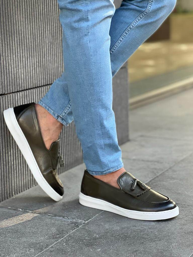 Khaki leather loafers with white EVA sole, featuring intricate crochet and iron details for a smart-casual spring look.