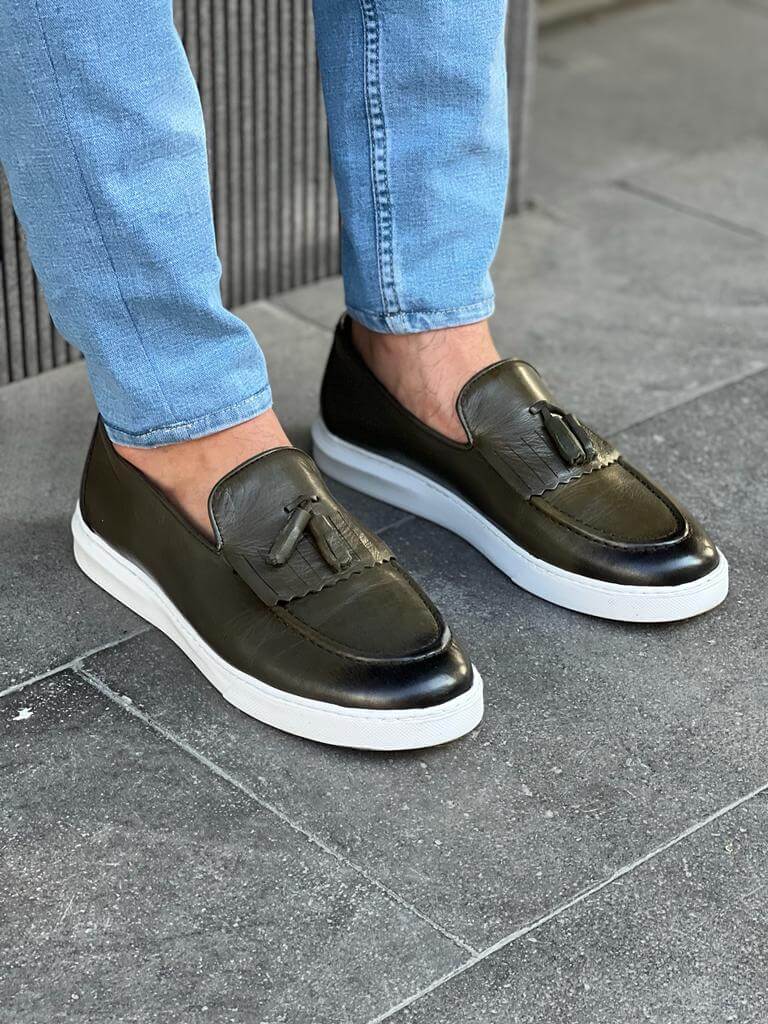 Khaki leather loafers with white EVA sole, featuring intricate crochet and iron details for a smart-casual spring look.