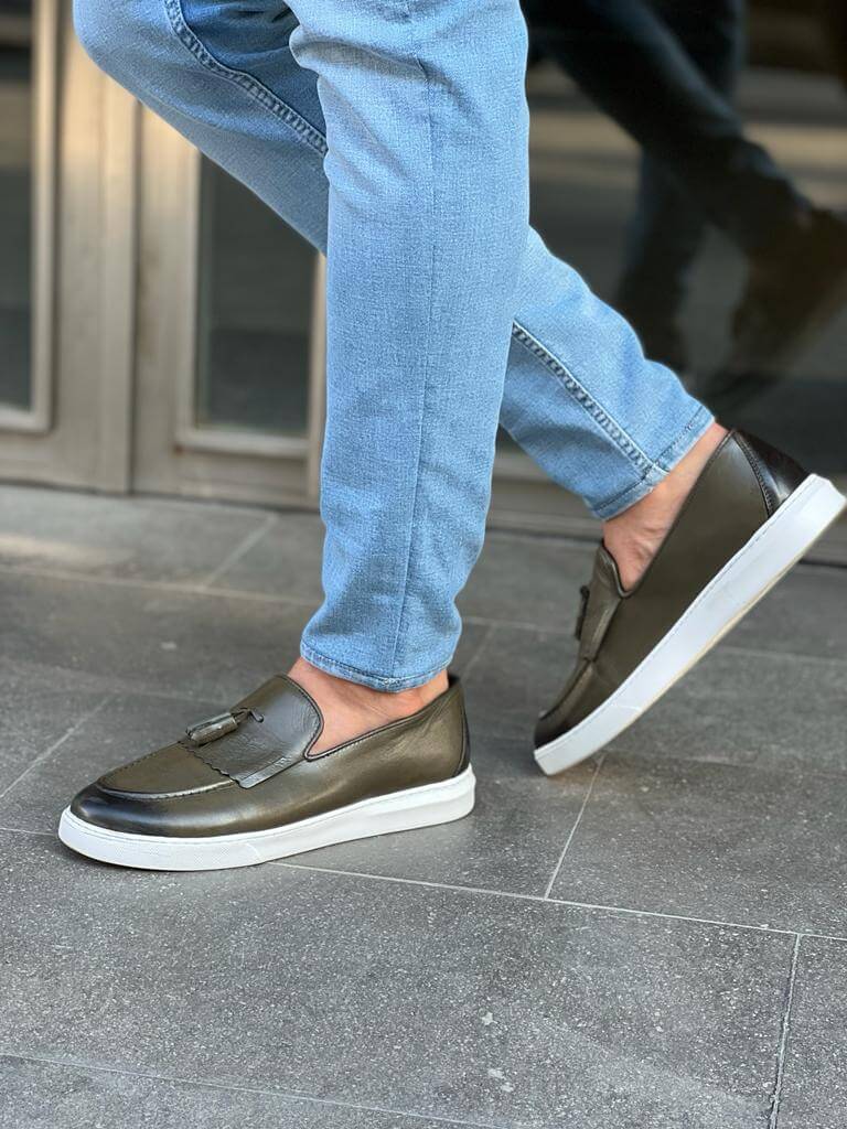 Khaki leather loafers with white EVA sole, featuring intricate crochet and iron details for a smart-casual spring look.