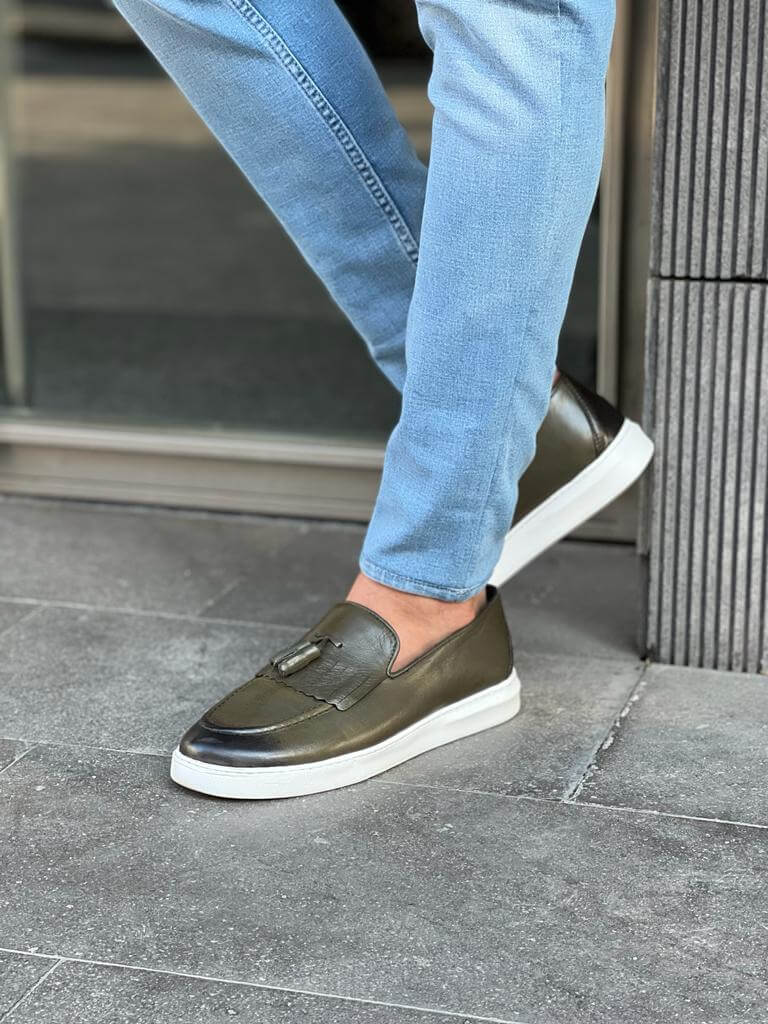 Khaki leather loafers with white EVA sole, featuring intricate crochet and iron details for a smart-casual spring look.