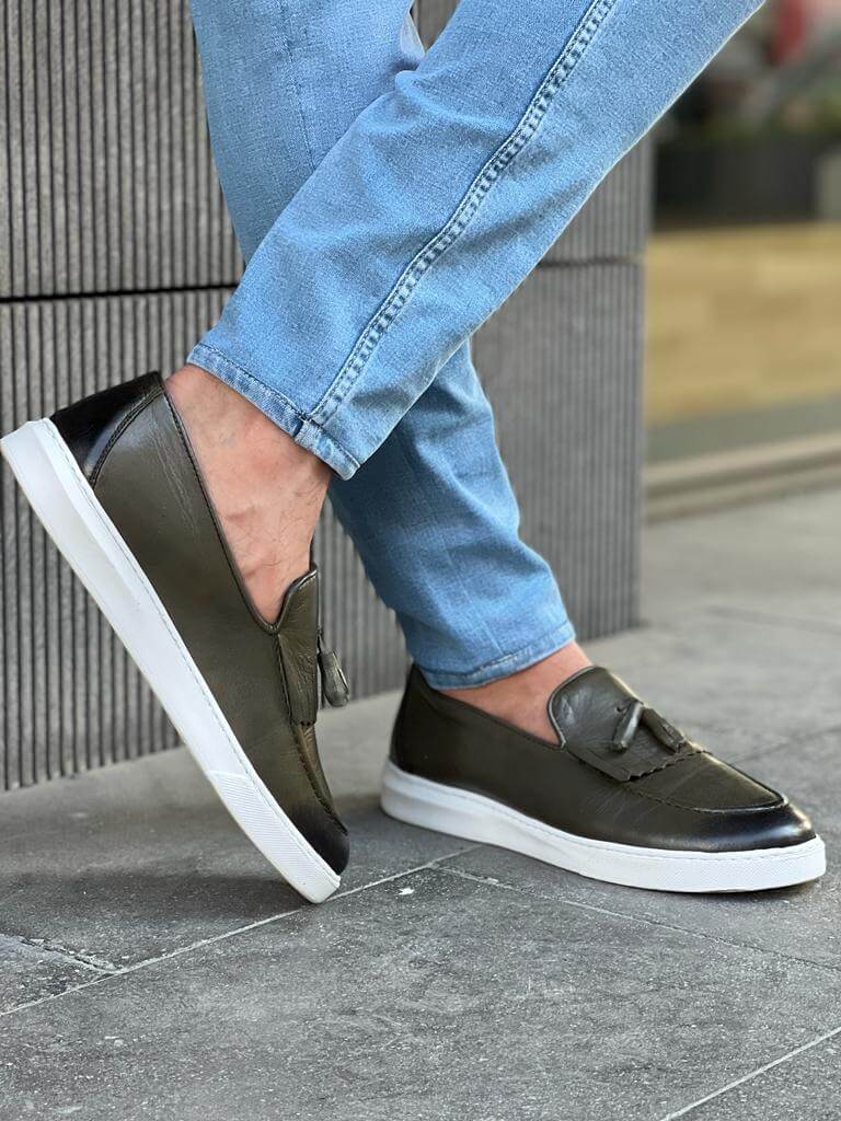 Khaki leather loafers with white EVA sole, featuring intricate crochet and iron details for a smart-casual spring look.