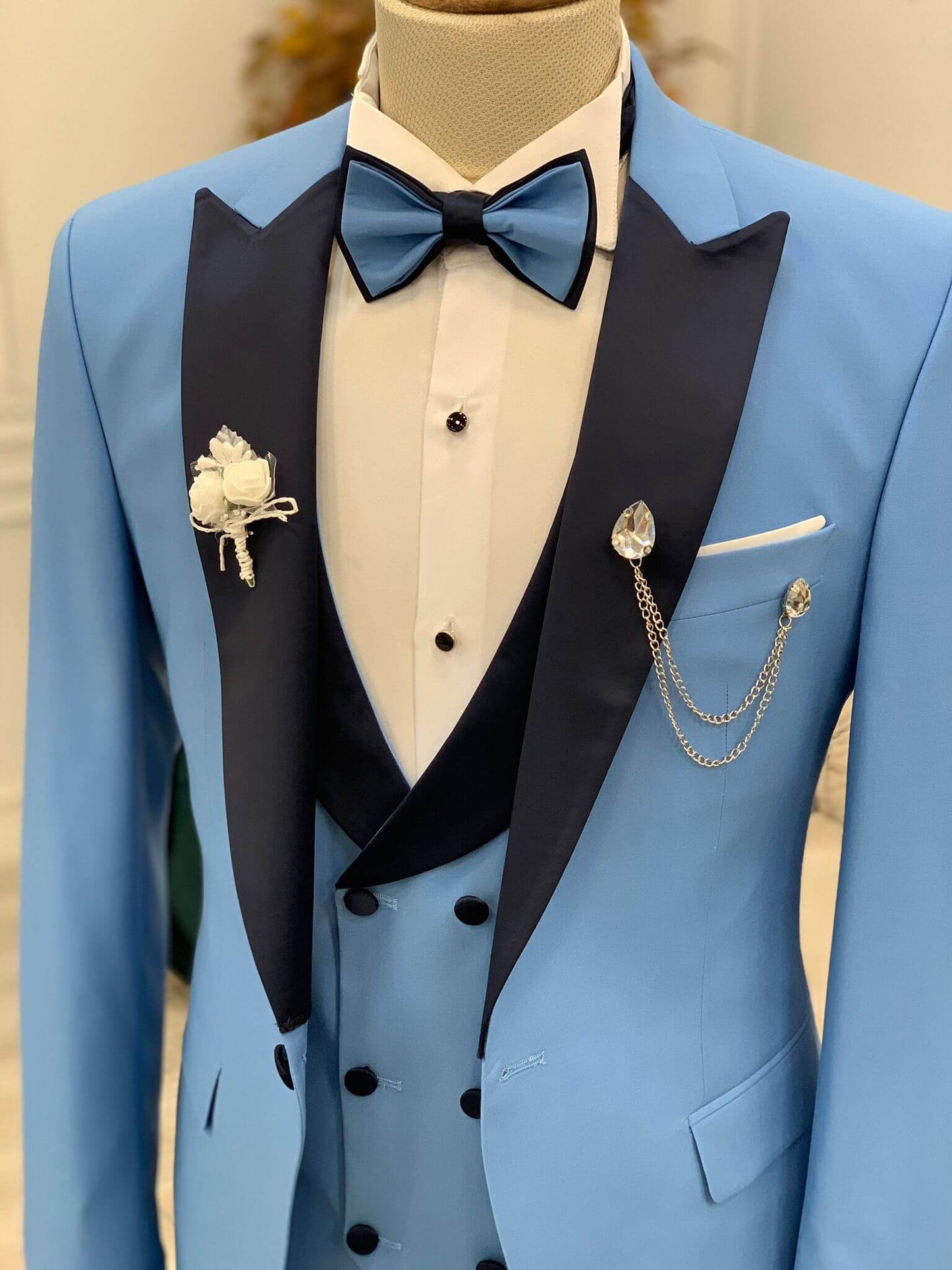 Slim Fit Blue Tuxedo from HolloMen’s Wedding Collection – includes jacket, vest, pants, shirt, bow tie, chain, and flower – a bold yet elegant look for weddings and upscale events.